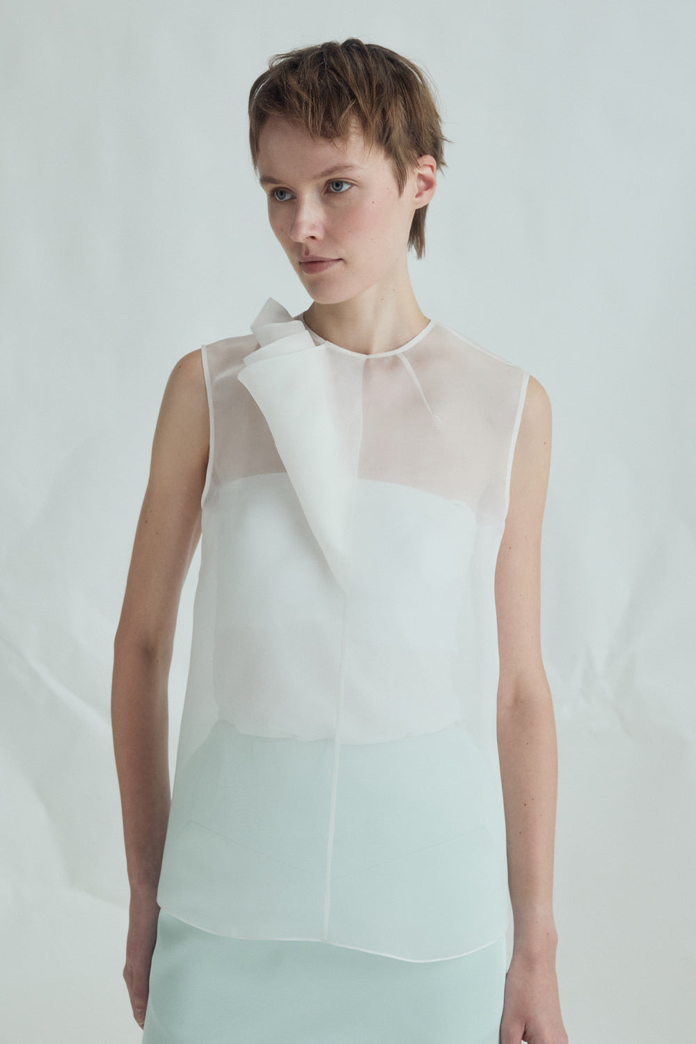 VICKTEERUT Sleeveless Blouse with Sculptural Rolled Fabric Detail เสื้อแขนกุด ตกแต่งผ้าม้วน