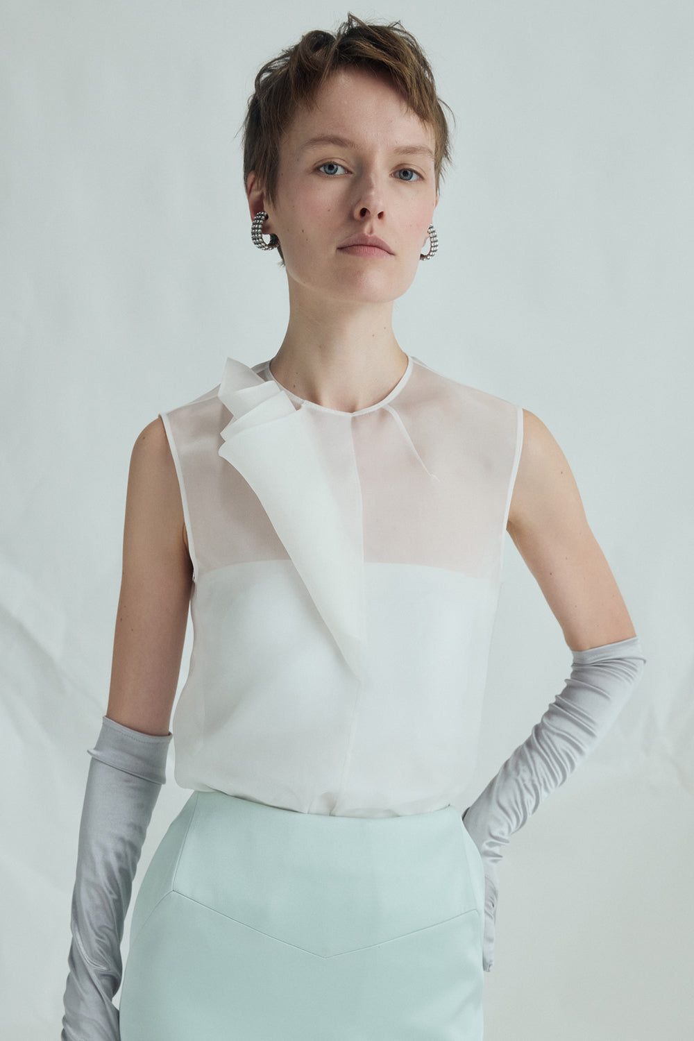 VICKTEERUT Sleeveless Blouse with Sculptural Rolled Fabric Detail เสื้อแขนกุด ตกแต่งผ้าม้วน