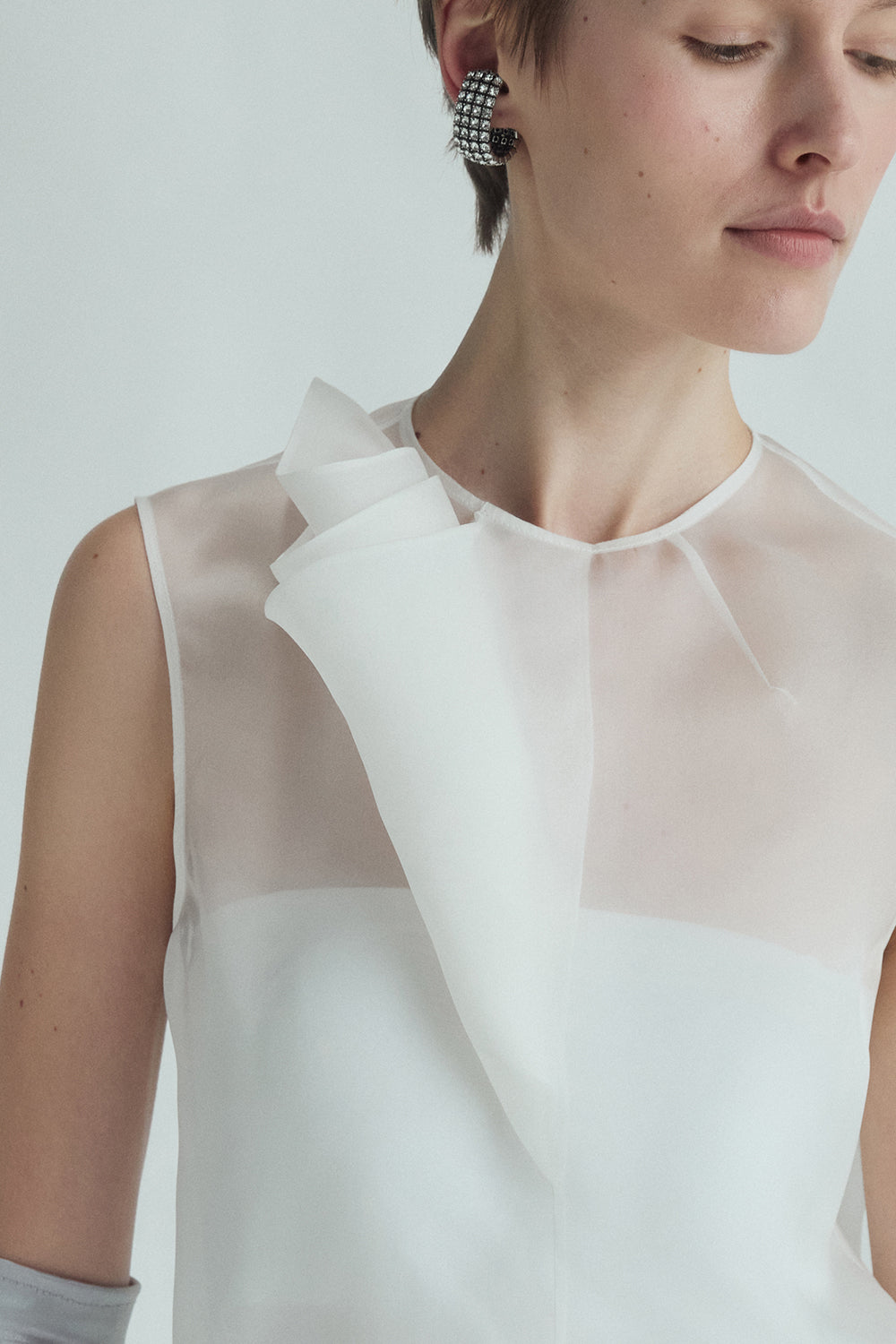VICKTEERUT Sleeveless Blouse with Sculptural Rolled Fabric Detail เสื้อแขนกุด ตกแต่งผ้าม้วน