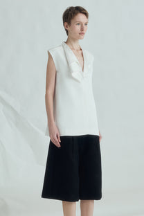 VICKTEERUT Sleeveless Blouse with Sculptural Rolled Neckline เสื้อแขนกุด ปกม้วน